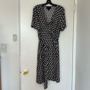 New without tag. Donna Morgan faux wrap short sleeve dress.  Size 14.
